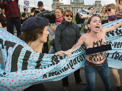 topless protesters storm catwalk causing security scare at