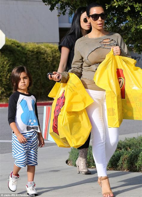 kim kardashian wears skintight white jeans on lego store