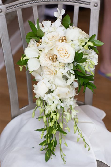 calla lilies with roses and orchids in a cascade bouquet bride bouquet