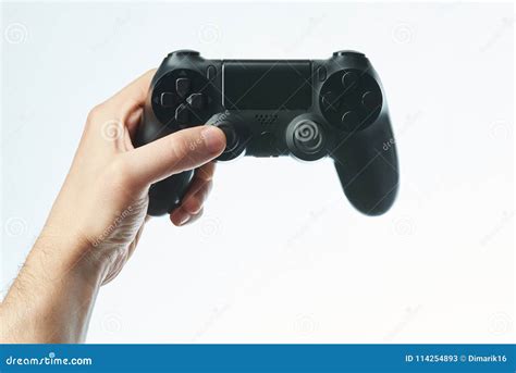 hand holding black game controller stock image image  gamer gaming