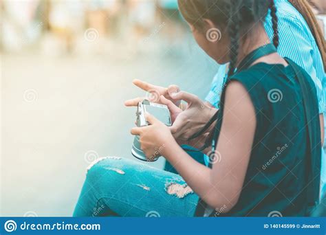 mom teaches her daughter to taking pictures stock image