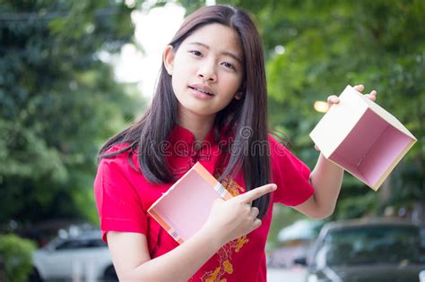 thai teen beautiful girl in chinese dress happy new year and open box t unhappy stock