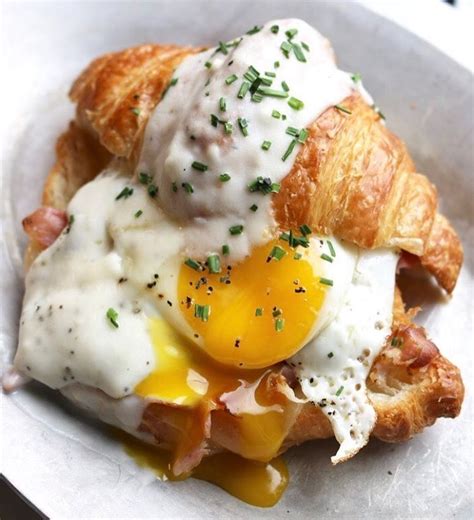 croque madame croissant ham gruyere mornay sauce and a runny egg