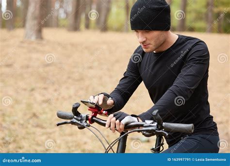 Picture Of Concentrated Amateur Cyclist Spending Weekends In Park