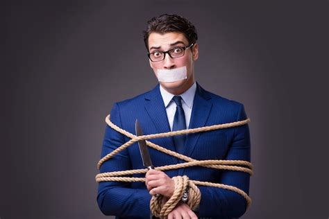 Premium Photo Businessman Taken Hostage And Tied Up With Rope