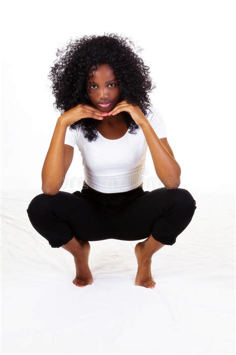 Attractive Skinny African American Teen Girl Squatting Stock Image