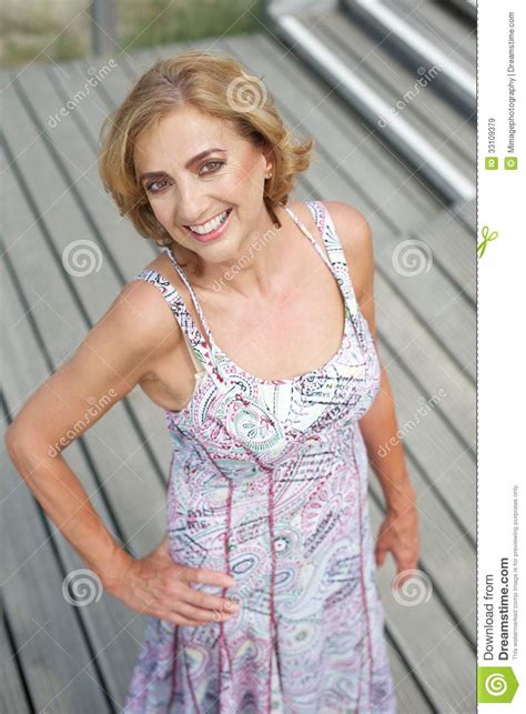 beautiful older woman posing outdoors with a smile stock image image of lady nature 33109379