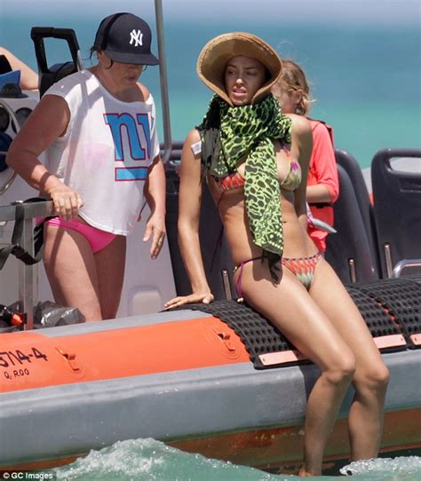 irina shayk almost suffers a wardrobe malfunction as string bikini slips daily mail online