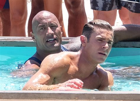 Dwayne Johnson And Zac Efron Swimming On The Set Of