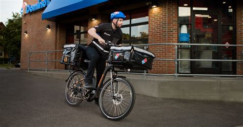 delivery  bikes  serve  hot pizza  dominos nationwide