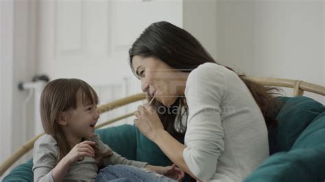 Medium Shot Of Mother And Daughter Sharing Lollipop Youtube