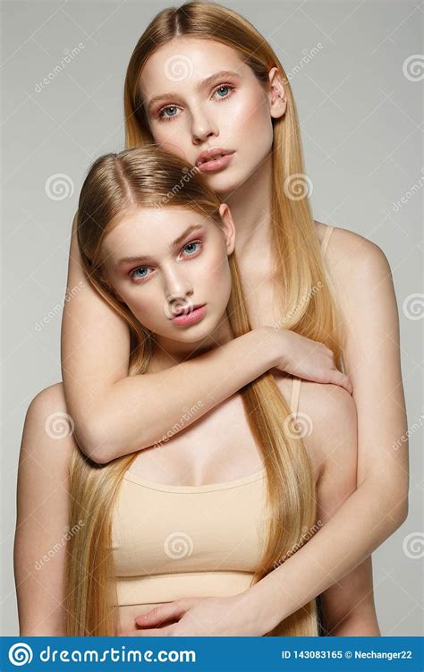 Two Beautiful Sister Twins Girls With Same Blonde Long