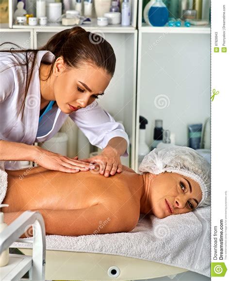 massage therapy deals woman therapist making manual therapy back