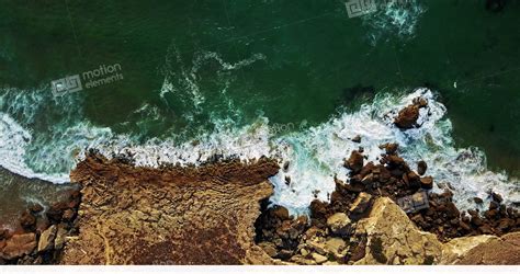 aerial view  drone  ocean waves  rocky beach stock video footage