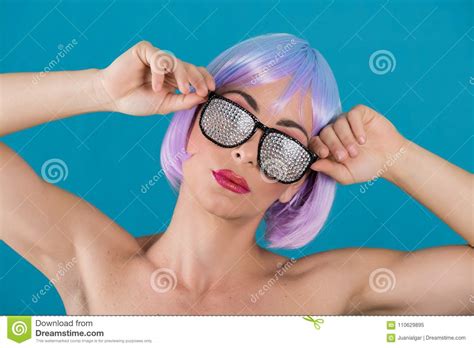 woman with purple hair in glamour glasses stock image
