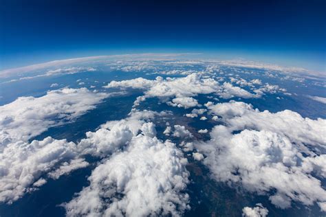 curvature  planet earth aerial shot blue sky  clouds acrp