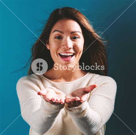 Happy Woman Showing Or Offering Something With Her Hands Royalty Free
