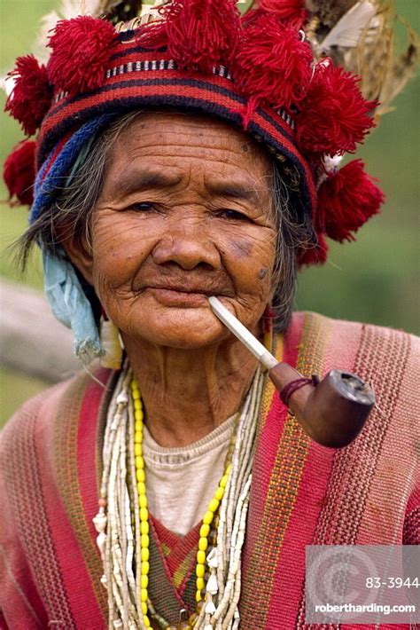 portrait of an elderly woman of the ifugao tribe wearing a woven hat