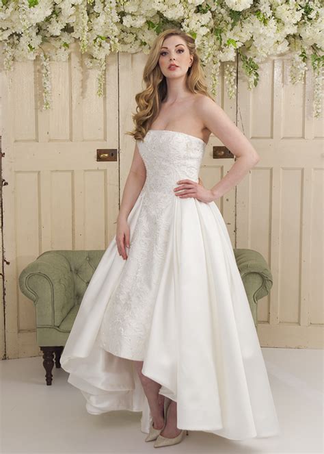 An Ivory Mikado High Low Wedding Dress With Lace Appliqué