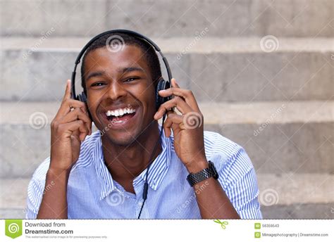 Happy African American Man Laughing With Headphones Stock