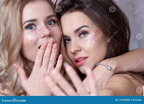 Blonde And Brunette With Light Makeup With Added Glitter Stock Image
