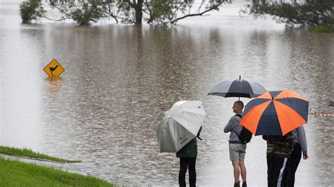 australia floods thousands flee  record rains swamp  south wales