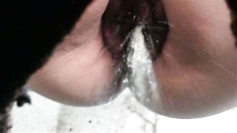 close up of pussy pissing over the toilet