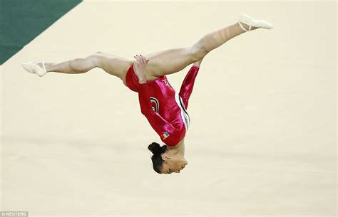 Spectacular Photos Show Gymnasts Gravity Defying Skills
