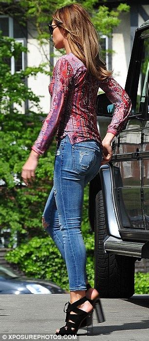 Abbey Clancy Showcases Slim Legs In Ripped Jeans And Colourful Shirt