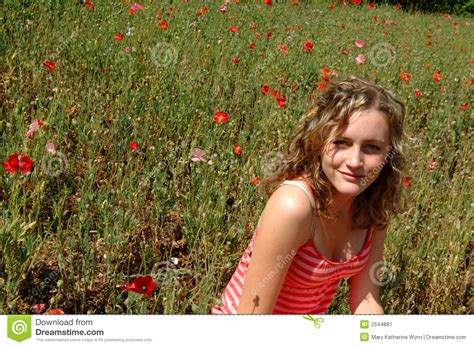 teen girl running in field
