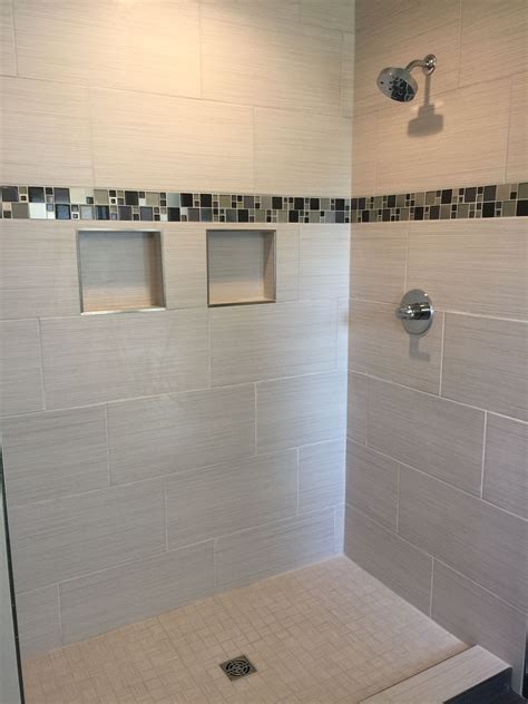 custom tiled shower   satiated tile run  staggered