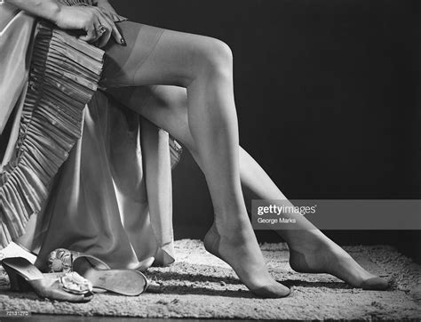 Woman Putting On Stockings Low Section Photo Getty Images