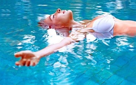 Sexy Model Girl In White Bikini Swimming Pool