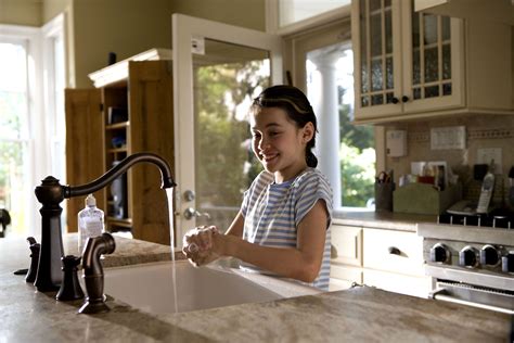 free picture girl laughing washing hands kitchen