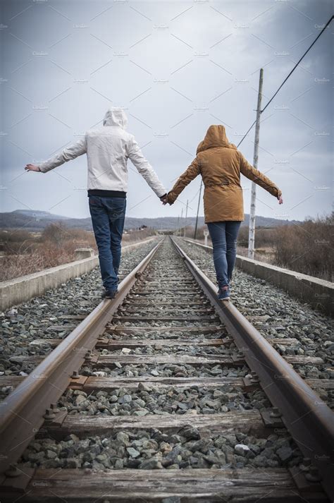 Young Couple Walking On A Railway ~ People Images ~ Creative Market