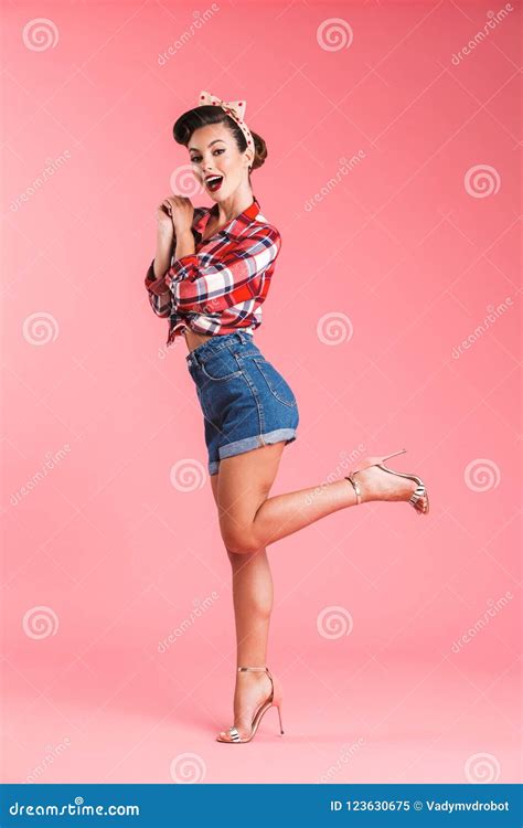 Full Length Portrait Of An Excited Brunette Pin Up Girl Stock Image