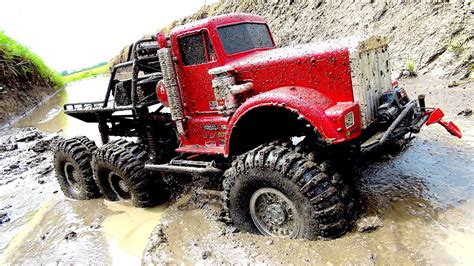 powerful  truck  muddy swamp  road axle repair job big red