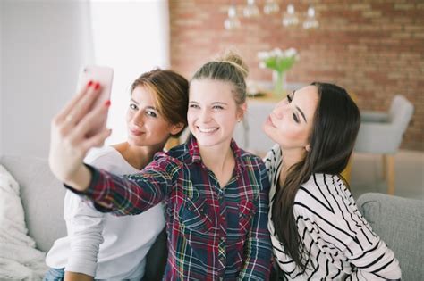 free photo pretty girlfriends taking selfie with smartphone