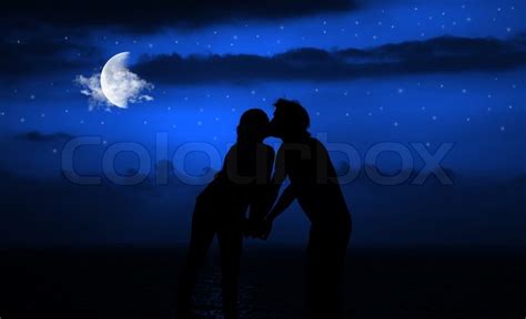 happy couple romantically kissing at stock image