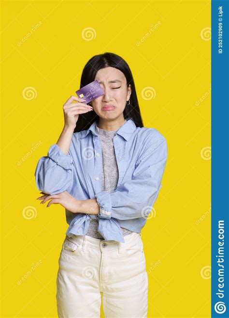 Sad Unhappy Asian Girl Cover Her With Bank Card Right Eye About To Cry