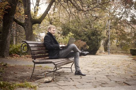 young man sitting  bench  p people images creative market