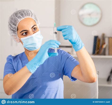 Girl Nurse In Mask Holding Syringe For Injection Stock Image Image Of