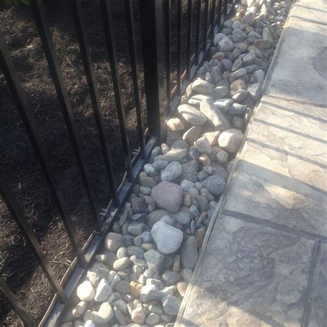 large river rock separated  mulch   composite edging