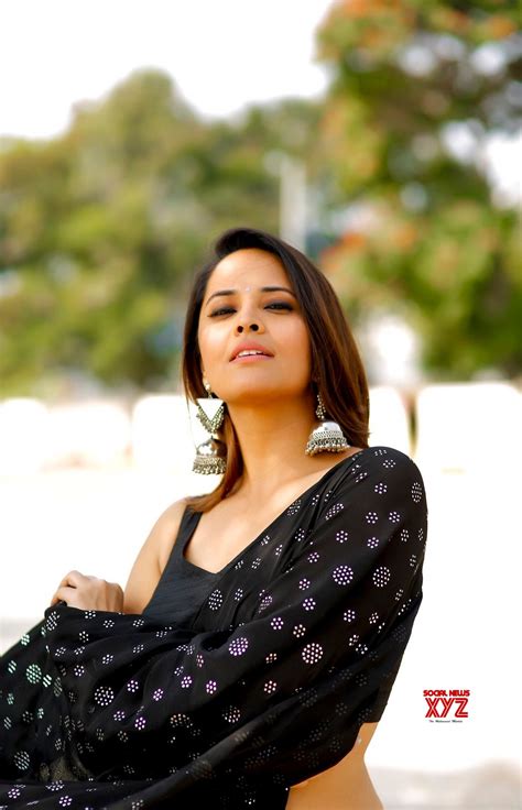 Actress Anasuya Bharadwaj Hot New Stills In A Black Saree