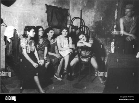 english five prostitutes waiting for customers in a brothel of