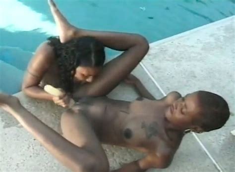 Wet Ebony Pussies Getting Stuffed With A Dildo By The Pool