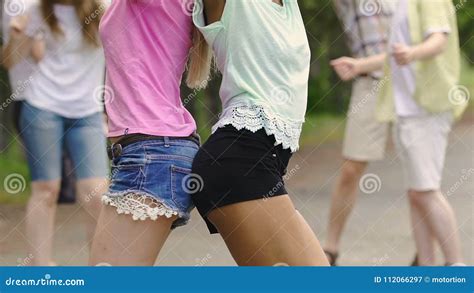 Beautiful Girls Shaking Bodies Dancing To Music At Outdoor Summer