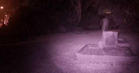 creepy picture shows ghost caught on camera in dark cemetery during