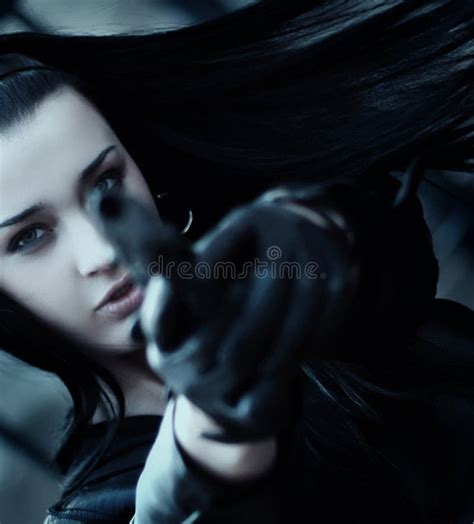 young woman  gun wearing gloves stock image image  beauty person