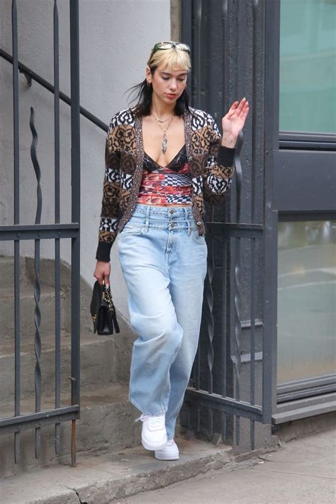 dua lipa spotted leaving her apartment while wearing a double denim